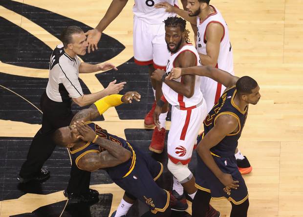 LeBron James #23 of the Cleveland Cavaliers reacts after being hit in the face by teammate Tristan Thompson #13 during the first half against the Toronto Raptors in game three of the Eastern Conference Finals during the 2016 NBA Playoffs at Air Canada Centre on May 21, 2016 in Toronto, Canada.