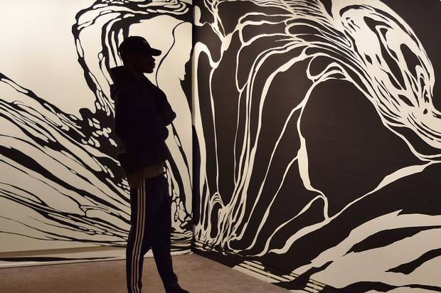 A Carleton student views Untying Space_CUAG, a ‘space drawing’ by Sun K. Kwak, at the university’s art gallery.