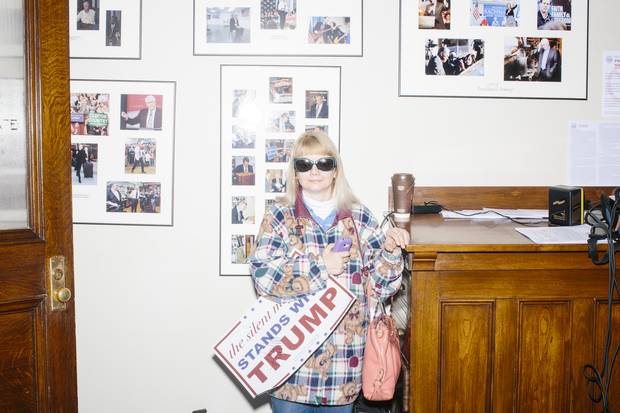 Trump supporter Holly Couture stands in the Secretary of State's office after he filed his candidacy in the New Hampshire primary. Ms. Couture said she was so excited at the chance to meet Mr. Trump that she couldn't get to sleep until 1 a.m. the night before. She got his autograph on the campaign sign and tried to get a picture with him, but her camera failed.