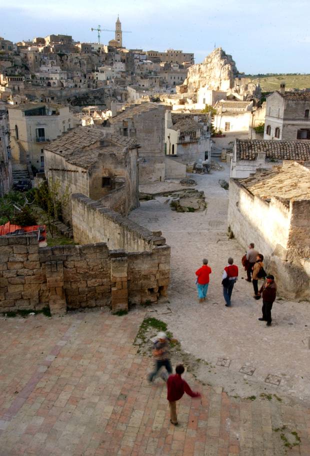 Children play in the sassi area of Matera, a UNESCO World Heritage site.