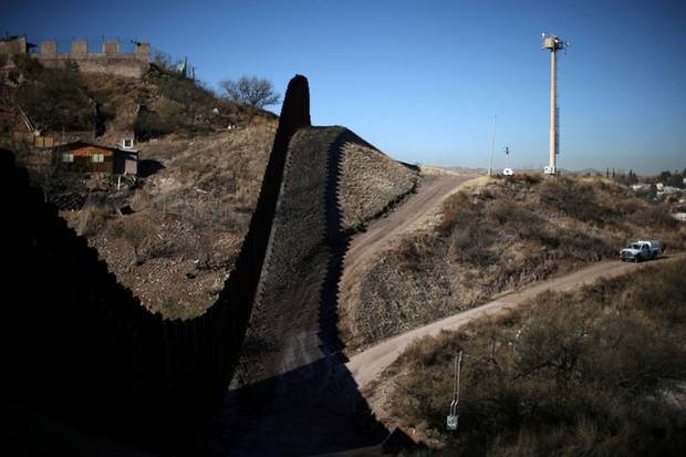 Jan. 31, 2017: A U.S. border patrol agent patrols the border with Mexico in Nogales, Arizona. Illegal crossings in Arizona’s Sonoran Desert rose dramatically after crackdowns and fence-building in California and Texas. Scores of migrants died of exposure or drowning.