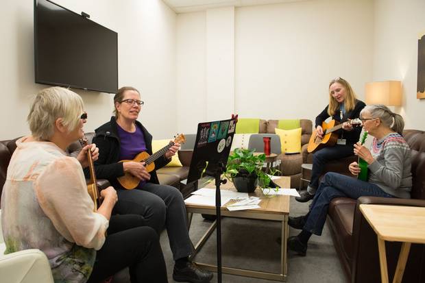 Wellspring Calgary members participate in an expressive arts class ukelele group, which aims to help with cognitive and physical issues affecting members living with and beyond cancer, or those who just want to have fun. Thanks to partnerships with home furnishing retailers, the client areas, such as this room, had already been made over. The staff and volunteer offices, however, were bare.