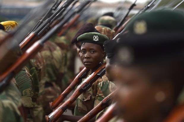 Soldiers of the Zimbabwe Defence Force stand in rank during drills on Nov. 23, 2017, at the national stadium in Harare.