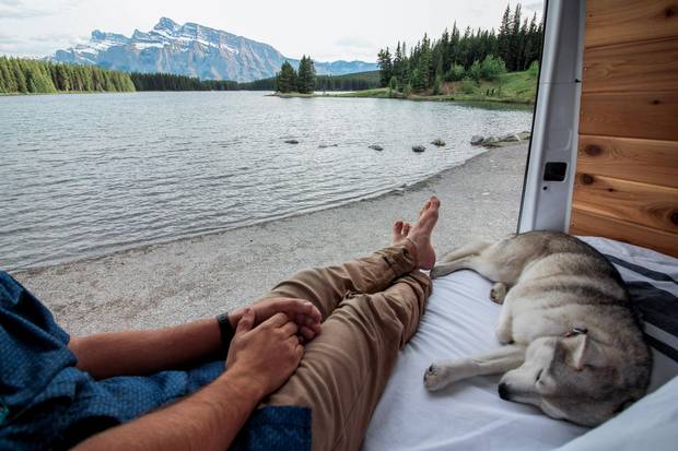 Another vanlifer enjoys the view from the back of his 2003 Dodge Sprinter 2500 van in Banff National Park in Alberta.