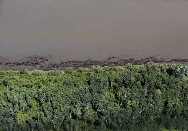 Oil is seen on the North Saskatchewan river near Maidstone on July 22, 2016. Officials say more assessments are needed before the river can be used as a drinking water source.