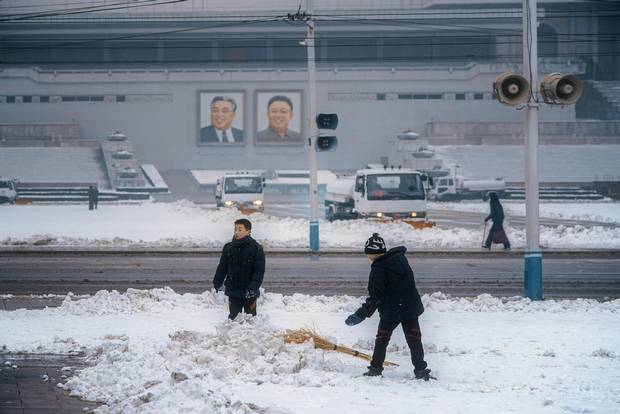 Boys take a break from their snow-removal tasks to stage a snowball fight in Kim Il-sung Square. Ringed with loudspeakers playing a constant loop of nationalist anthems and announcements, the plaza is anchored by the country’s largest library: the 600-room Grand People’s Study House.
