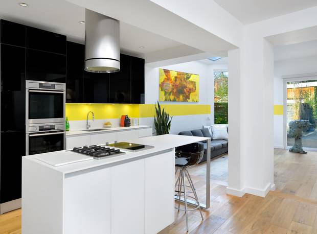 A yellow stripe runs from the family room to the kitchen.