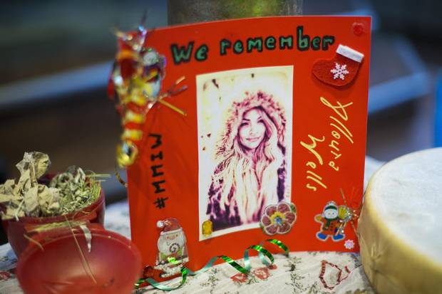 Photos of Alloura Wells are displayed at her memorial in Toronto on Dec. 12, 2017. The twenty-seven-year-old trans woman had been missing since July. Her name was finally put to a body discovered in a Rosedale ravine in August.