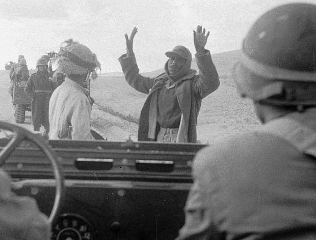 An Egyptian soldier surrenders to an Israeli army patrol in the Sinai Desert on Nov. 1, 1956.