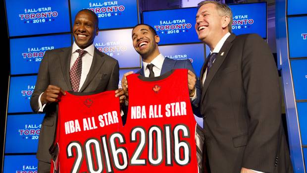 Toronto Raptors general manager Masai Ujiri (L), rapper Drake, and President and CEO of Maple Leaf Sports and Entertainment Tim Leiwekea (R) pose after an announcement that the Toronto Raptors will host the NBA All-Star game in Toronto, September 30, 2013.