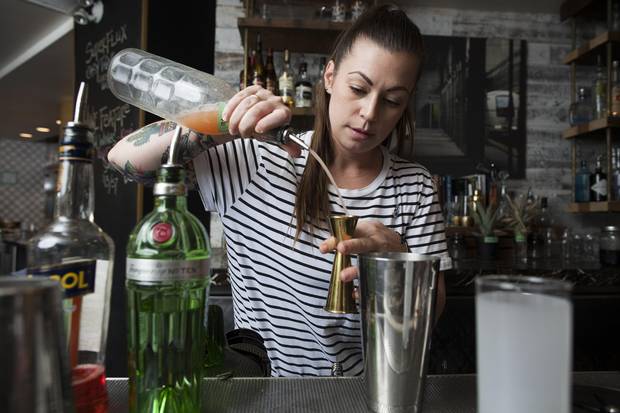 Canadian bartender Kaitlyn Stewart, who won the Diageo World Class cocktail competition in Mexico City last month, prepares one of her winning drinks, the Tom Cat Collins.