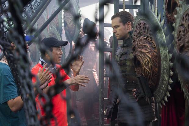 Director Zhang Yimou, left, speaks with Matt Damon on the set of The Great Wall. The film hit translation snags, with the mere act of speaking on set becoming so difficult that extra interpreters were brought it.
