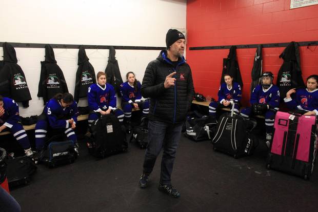 Nunavik Nordiks coach Joe Juneau talks to his players in the dressing room before a game March 24, 2017 in Ottawa. The Inuit girl's hockey team is in Ottawa for a tournament. DAVE CHAN / THE GLOBE AND MAIL