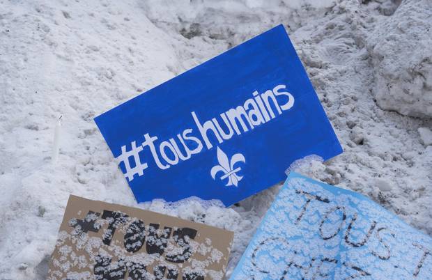 A message with the slogan “all human” and the Québécois fleur-de-lis lies near the Centre culturel Islamique de Québec on Jan. 31, 2017.