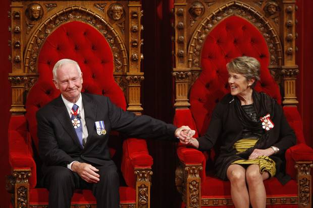 Oct. 1, 2010: Mr. Johnston and his wife, Sharon, sit on the throne after his swearing-in.