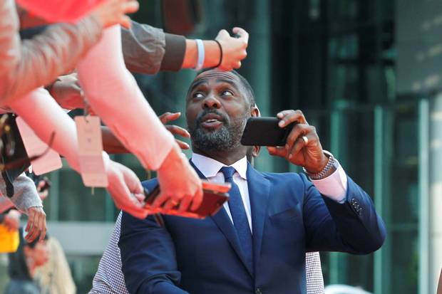 Idris Elba greets fans at the premiere of The Mountain Between Us.