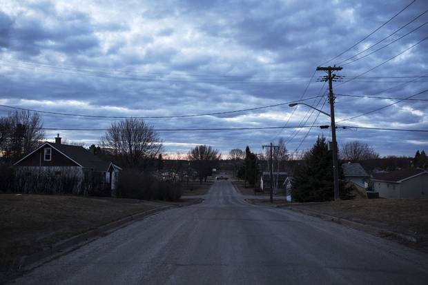 A truck drives down a lonely road in Dryden. The community is one of many in northern and northwestern Ontario where Indigenous people, moving to urban centres in hopes of better lives, grow the economies of otherwise struggling cities.