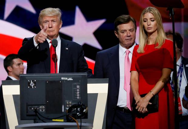 Donald Trump gives a thumbs up as his campaign manager Paul Manafort and daughter Ivanka look on during Trump's walk through at the Republican National Convention in Cleveland in July.