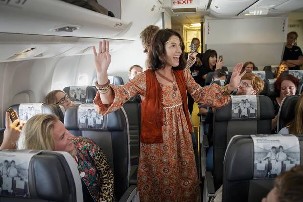 Icelandair staff and actors sing to passengers as they star in Ahead of Time, an immersive theatre production on a flight from London to New York in September.