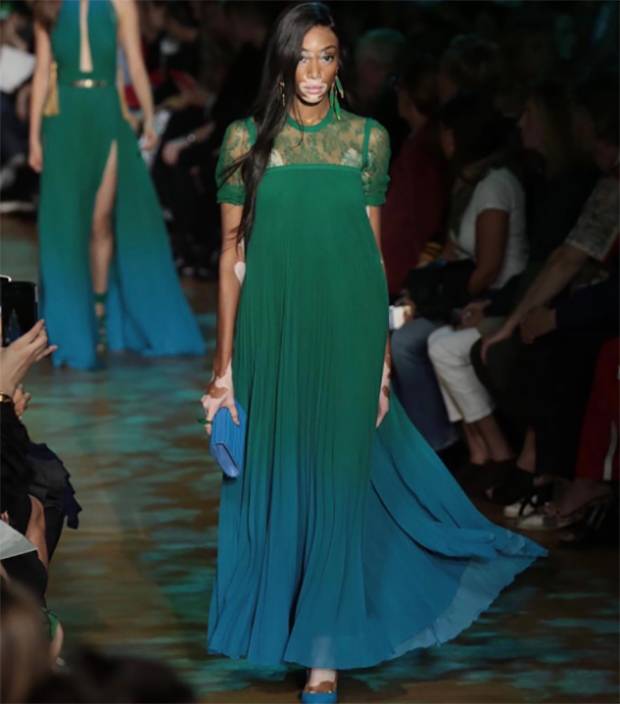 ELIE SAAB (Sept. 30) Welcome to the jungle that is @eliesaabworld, where the collection's inspiration stemmed from the Amazon. Python print, tropical botanicals and golden leaf accents rounded out this collection of day and eveningwear, which included the pleated forest green and blue dress sported by Canadian model @winnieharlow. RG @eliesaabworld #pfw #pfwss18 #parisfashionweek #amazoncrush