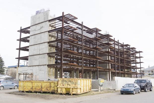A condo under construction sits vacant in downtown Fort McMurray. Business is slow.