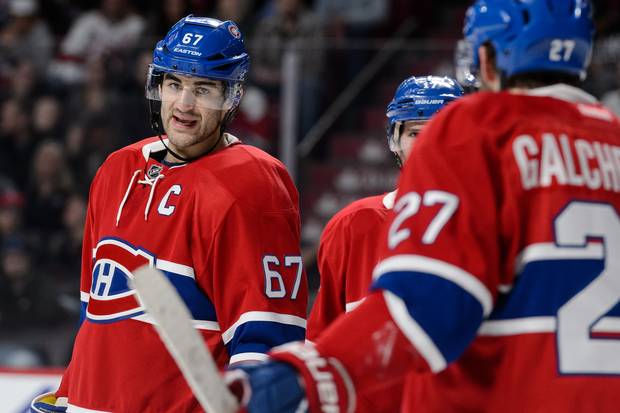Max Pacioretty #67 of the Montreal Canadiens speaks with teammates during the NHL game against the Detroit Red Wings at the Bell Centre on March 29, 2016 in Montreal, Quebec, Canada. The Montreal Canadiens defeated the Detroit Red Wings 4-3.