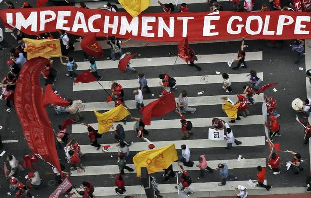 Members of labour unions protest in Sao Paulo on Dec. 16, 2015.