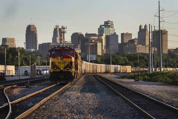 A Kansas City Southern locomotive sits in a rail yard in Kansas City, Mo.