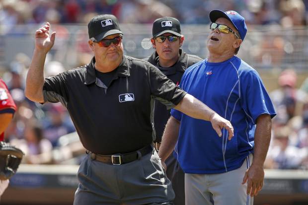Toronto Blue Jays manager John Gibbons, right, is ejected on Sunday in Minneapolis. It was his fourth ejection of the season.