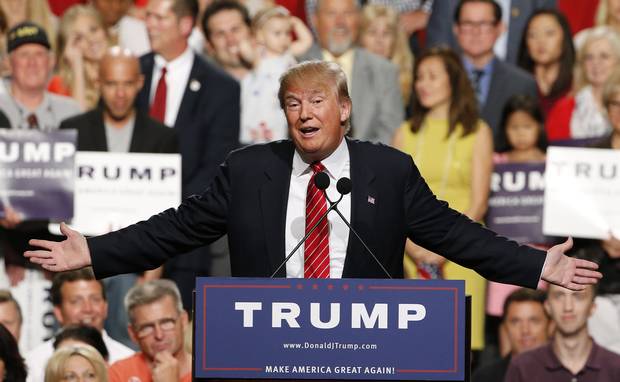 In this July 11, 2015 photo, then-Republican presidential candidate Donald Trump speaks before a crowd of 3,500 Saturday, July 11, 2015, in Phoenix. 