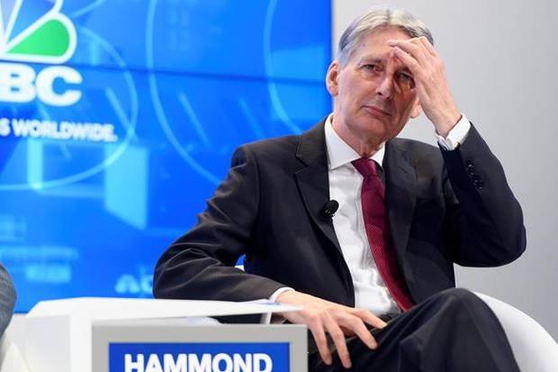 British Chancellor of the Exchequer Philip Hammond speaks during a panel session during the 48th Annual Meeting of the World Economic Forum, WEF, in Davos, Switzerland, Thursday, Jan. 25, 2018. (Laurent Gillieron/Keystone via AP)