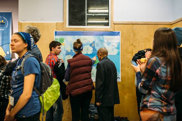 People examine the map of the new protected area of Lancaster Sound.