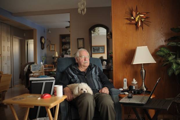 Ken Fritz, an 82-year-old retired small business owner from Regina, at home with his dog, Angel. Fritz was ripped off in a stock scam more than a decade ago.