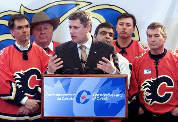 Mr. Prentice, left, stands by Conservative leader Stephen Harper’s side at a rally in Calgary on May 28, 2004.