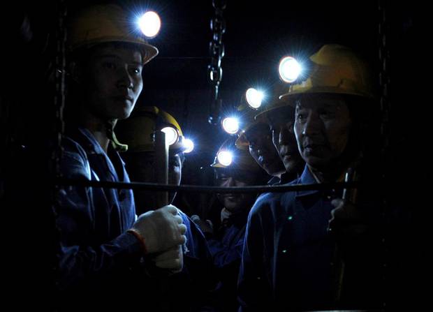 In this Tuesday, Sept. 8, 2009 photo released by China's Xinhua News Agency, rescue workers enter the Xinhua No. 4 coal mine in Xinhua district of Pingdingshan city, central China's Henan Province.