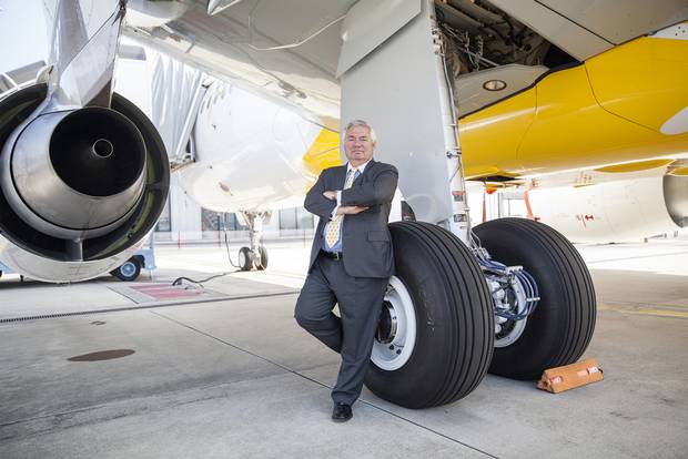 Airbus's John Leahy poses for a photograph during an event to mark the debut flight of the Airbus A320neo aircraft in 2014.