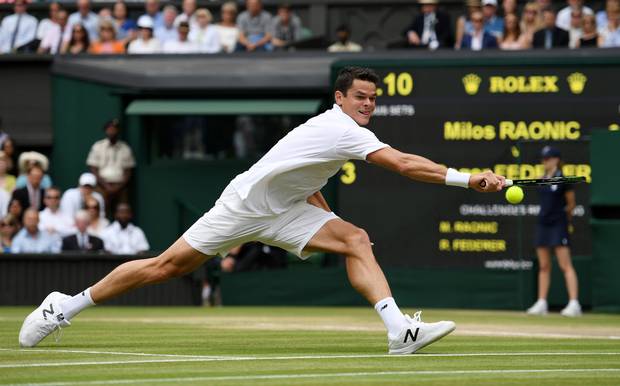 Milos Raonic of Canada plays a backhand during the Men's Singles Semi Final match against Roger Federer of Switzerland.