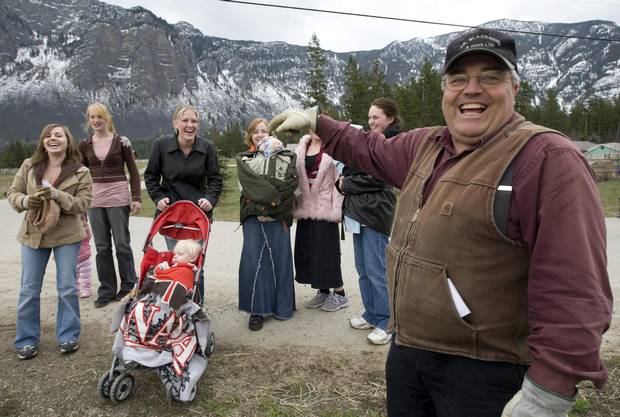 Winston Blackmore, the religious leader of the polygamous community of Bountiful, B.C. shares a laugh with six of his daughters and some of his grandchildren on Monday, April 21, 2008.