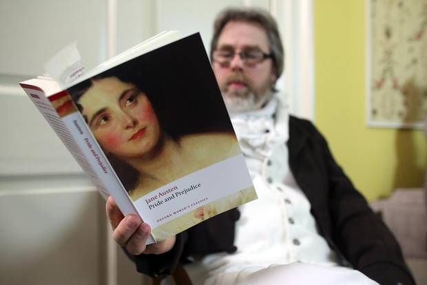 A reader waits as part-time actor Ashley Green (not seen) reads chapter ten of Jane Austen's Pride and Prejudice at the Jane Austen Centre on January 28, 2013 in Bath, England.