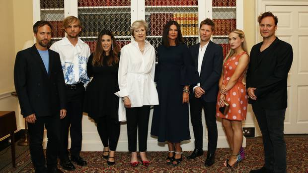 British Prime Minister Theresa May welcomed London’s fashion crowd, including from left, Peter Pilotto, Christopher de Vos, Mary Katrantzou, Natalie Massenet, Christopher Bailey, Sophia Webster and Nicholas Kirkwood to a reception at the start of London Fashion Week last September.