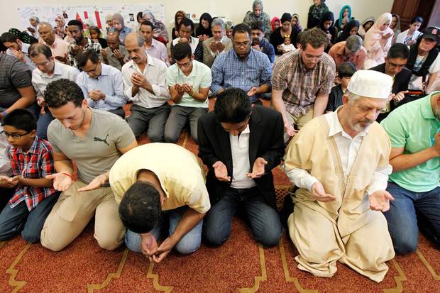 Members of the Louisville Islamic Center pray together before an inter-faith service to honor Muhammad Ali on June 5.