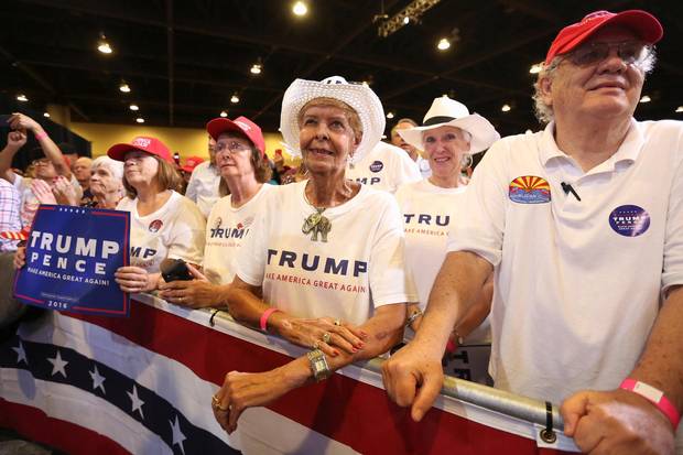 Supporters listen to Mr. Trump in Phoenix on Wednesday night.