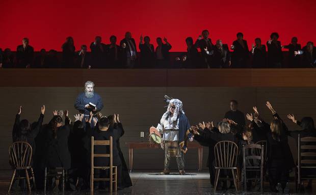 A chorus of indigenous performers onstage throughout the opera are clothed in a sea of red, and then, at a critical moment, change to black.
