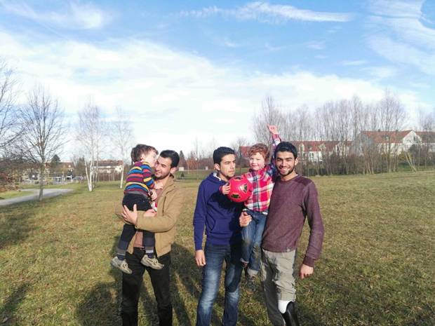 Joanna Slater’s sons meet the Omran brothers, from left, Basel, Zain El Abedin and Osama, in Munich in December. Osama had part of his leg blown off in Syria and travelled from Turkey to Germany on crutches.