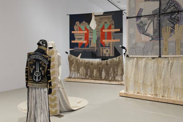 The first piece of work visitors encounter at the gallery are a collaboration between Nep Sidhu and Tlingit/Unanga artist Nicholas Galanin. SHE in Light Form, No Pigs in Paradise and SHE in Shadow Form, No Pigs in Paradise are two sculptural figures, posed opposite each other as if balancing the room, costumed and adorned with emblems traditional of Sikh and First Nations cultures.