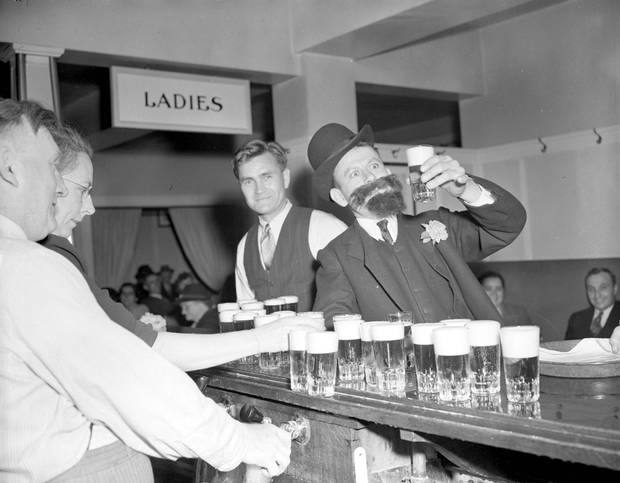 Patrons partake in libations at the Kinsmen Carnival beer parlour in Revelstoke, B.C., on June 30, 1944.