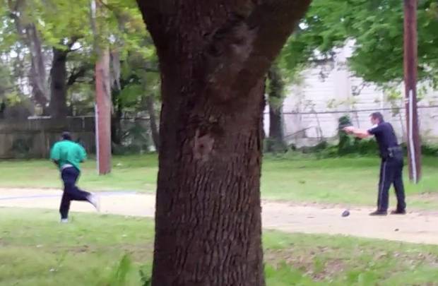 In this April 4, 2015, frame from video provided by attorney L. Chris Stewart, representing the family of Walter Lamer Scott, Mr. Scott runs away from city patrolman Michael Slager, right, in North Charleston, S.C.