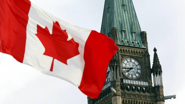 The Canadian flag flies on Parliament Hill in this file photo.