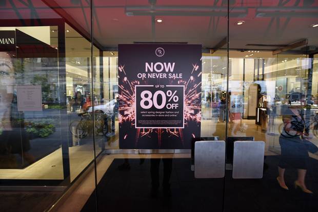 A sale sign at a Holt Renfrew location on Toronto's Bloor Street.