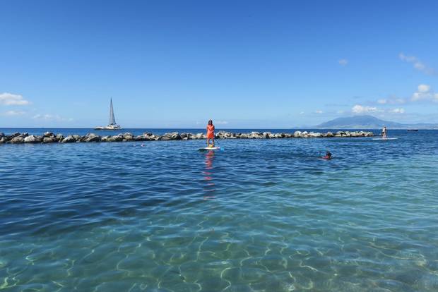 The absence of strong currents on the west side of Nevis makes for a relaxing stand-up paddle board ride.